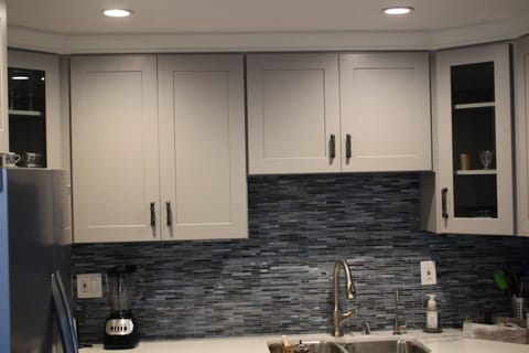 View of recessed lighting, new kitchen faucet with a filtered water sprocket