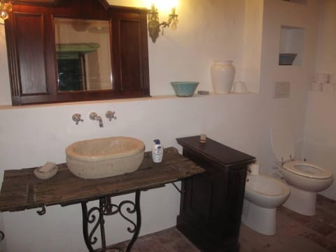 Main Bathroom - tuffo stone sink, bidet, toilet, washing machine