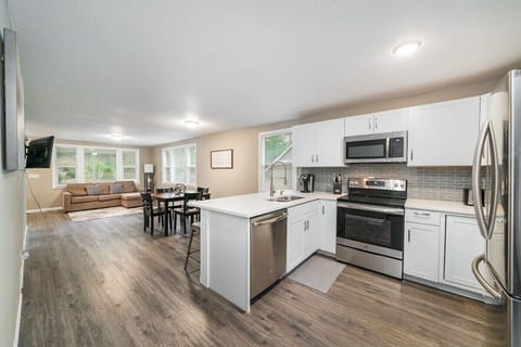 Updated Kitchen with Stainless Steel Appliances and Quartz counter-top