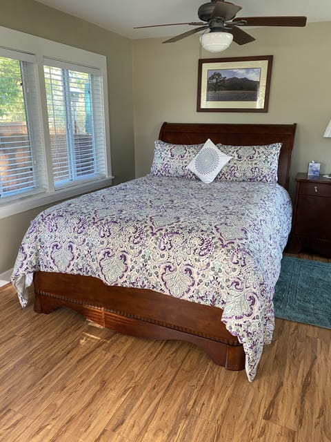 Large master bedroom with queen size bed and futon