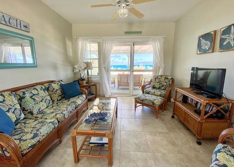Living room with gorgeous views and access to veranda and beach.