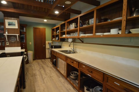 Kitchen has a half bath adjacent with second utility sink for large pans.