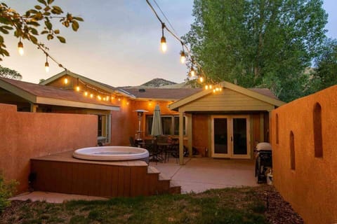 Courtyard evening view. Cozy courtyard with string lights, hot tub, 2 cruiser bikes and gas grill.