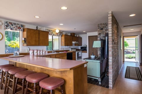 Our large kitchen, bar and my great grandmothers antique stove