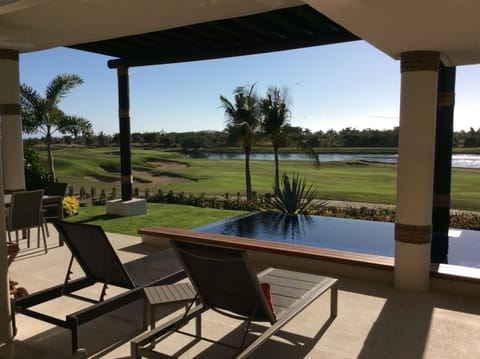 A heated pool, sun loungers