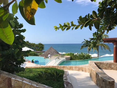 A heated pool, sun loungers