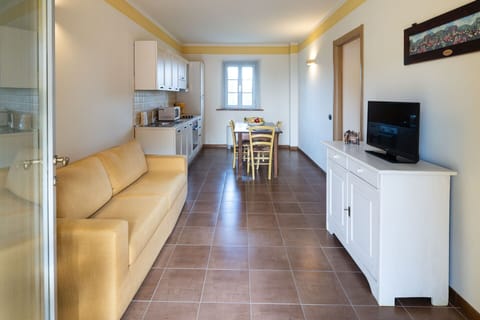 Furniture, Picture Frame, Property, Couch, Interior Design, Flooring, Living Room, Floor, Houseplant, Wall