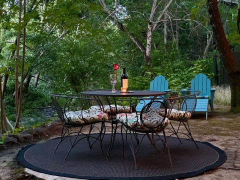 Dine alfresco next to the creek... with your favorite bottle of wine.