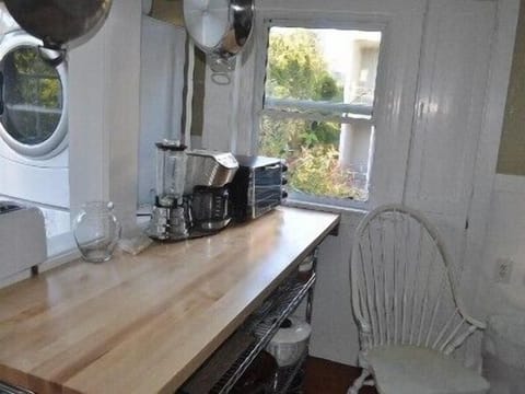 Prep area w/ Henckles knives, mixer, blender, rotisserie, washer/dryer and more.