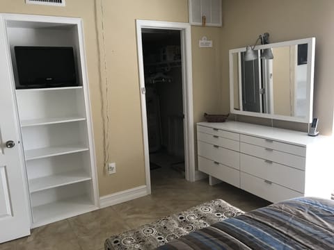 One tv in bedroom and other in living room. Large closet has combo w/d.
