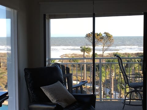 True 270 degree direct ocean front view from kitchen. 55” Samsung QLED Smart TV