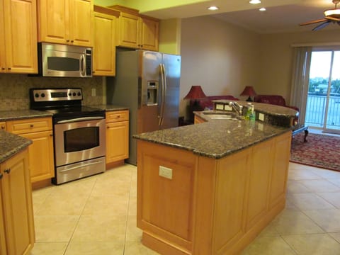 Kitchen features granite countertops and stainless appliances.
