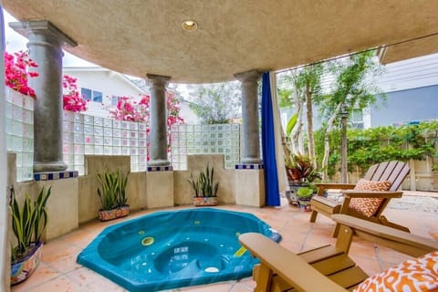 Private in-ground spa retreat patio with pull curtains. Great place to unwind.