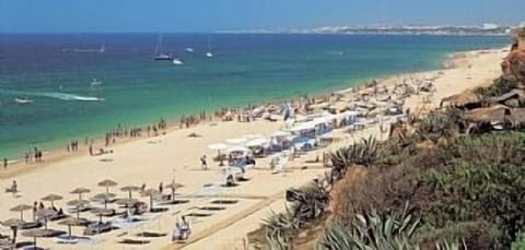 On the beach, sun loungers, beach towels