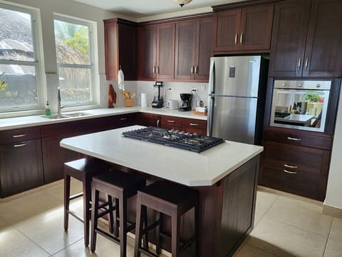 Seating at kitchen island allows for open-concept dining and entertaining
