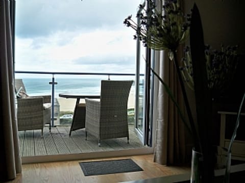 View from sofa to balcony & beach.