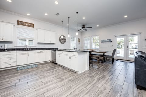 View from stairs to kitchen and dining area.