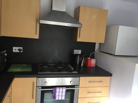 Small fridge, kettle, microwave and toaster and all the basics for cooking