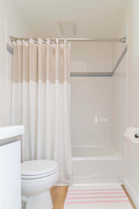 Combined shower/tub, hair dryer, towels, soap