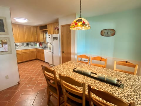 Open dining that seats 6 and fully stocked kitchen.