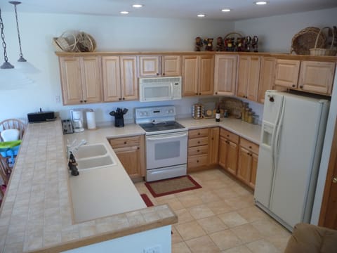 Convenient, fully stocked, gourmet kitchen, optional childproof locks