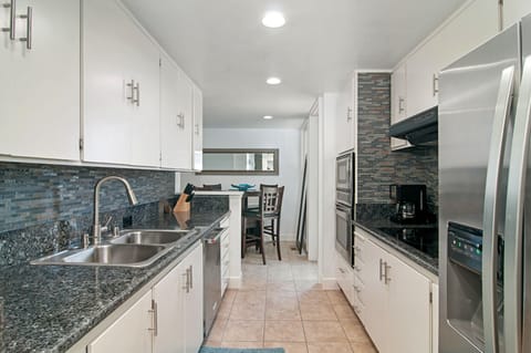 kitchen with closet washer and dryer and dinette for 4