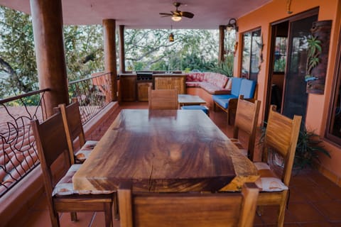 Terrace with a dining table table 