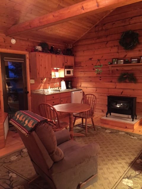 The kitchenette is fully stocked and the fireplace is warm and cozy.