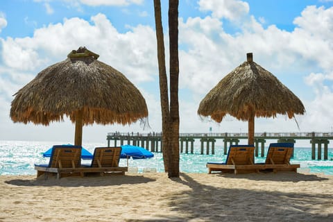 On the beach, sun loungers, beach towels