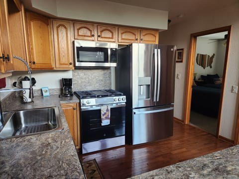 Large, fully equipped kitchen with brand new stainless steel appliances