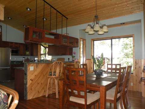 Indoor dining room, granite bar top with swivel chairs.