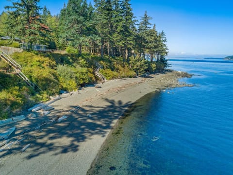 Short trip down stairs to the beach - Relax and enjoy this tranquil beach house setting.