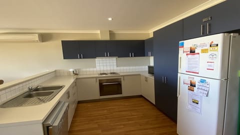 Microwave, oven, dishwasher, dining tables