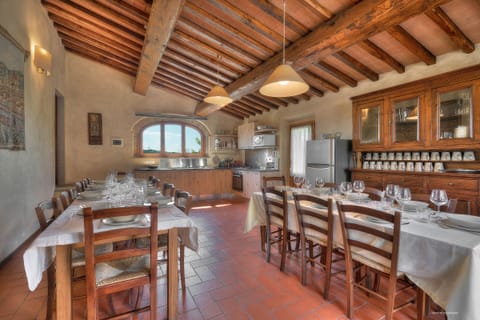The diningroom for up to 20/22 people next to the largest kitchen in the Villa