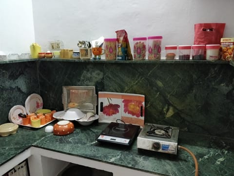 Fridge, electric kettle, toaster, cookware/dishes/utensils