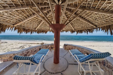 On the beach, sun loungers, beach towels