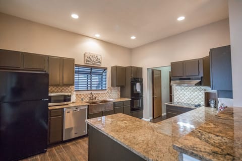 Kitchen equipped with all cooking and dining essentials