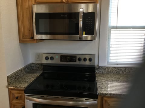 New Stainless range and microwave; excellent for family sized dinners.