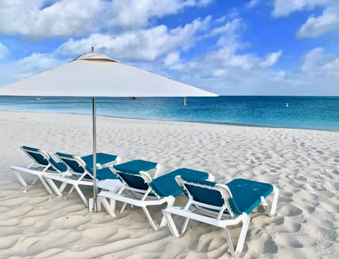 On the beach, sun loungers, beach towels