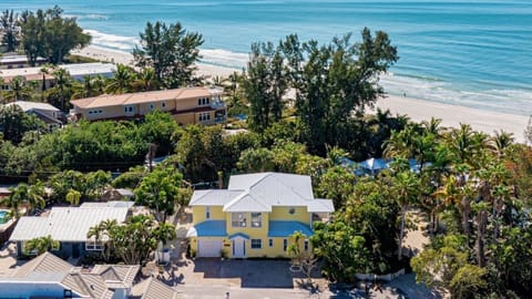 Welcome to Surfside AMI, the beloved yellow house next to the beach!