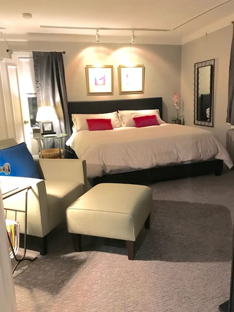 Very spacious bedroom with king bed, Smart TV and lounge chair