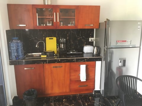 Fridge, stovetop, coffee/tea maker, cookware/dishes/utensils