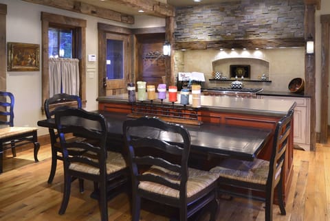 Dining table adjacent to the kitchen island can be pulled out for more space