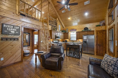 Kingfisher is an open concept cabin with a ladder leading to the sleeping loft.