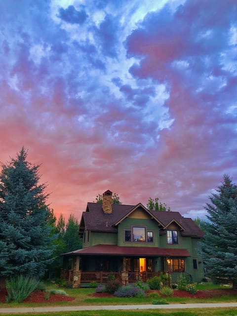 Lovely sunset picture of the front of the house in summer time. 