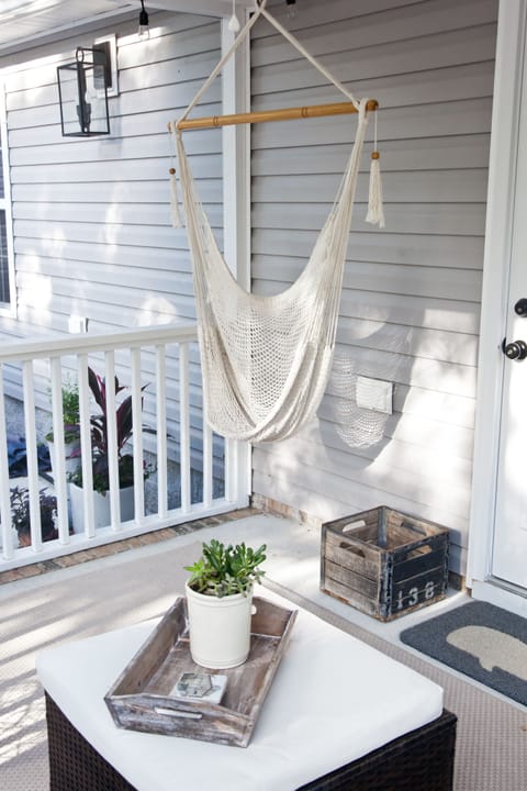 Guests love the screen porch hammock chair!