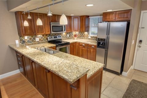 Stunning Kitchen with cherry cabinetry and stainless appliances.