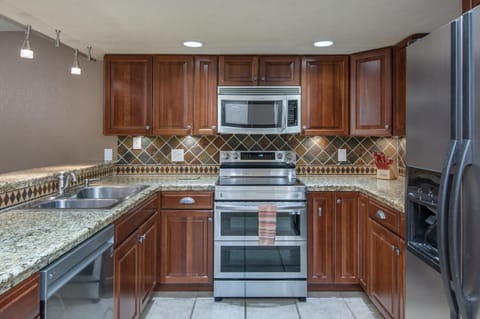 Appliances include double ovens/range, dishwasher, microwave, and refrigerator