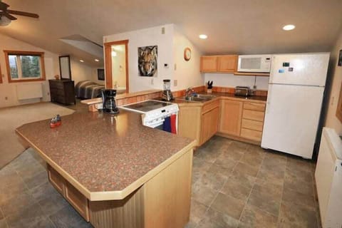 (2) spacious well equipped kitchen for at home cooking needs