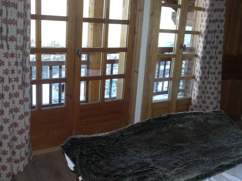 The double French windows in the triple bedroom, leading onto its great balcony!